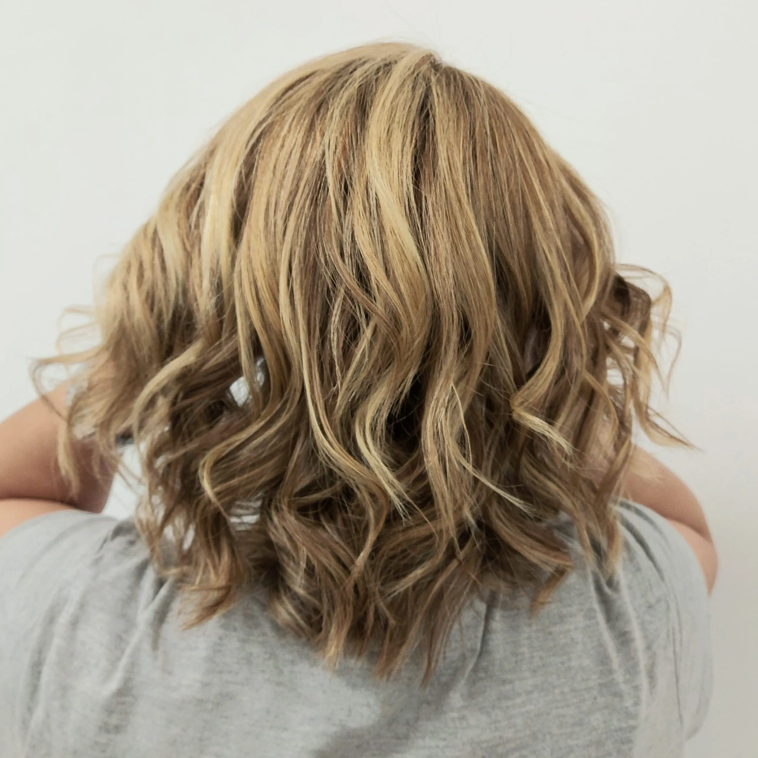 Elegant hair styling and color treatment by Stellar Beauty professionals in Port Coquitlam